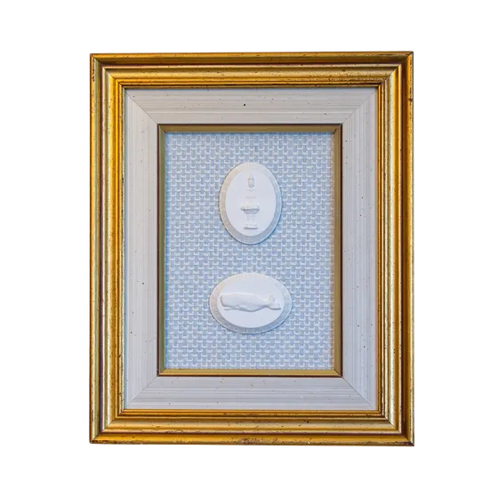 Custom framed intaglios with a blue backing